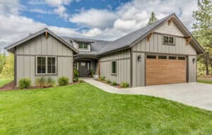 A home with a garage and a large yard.